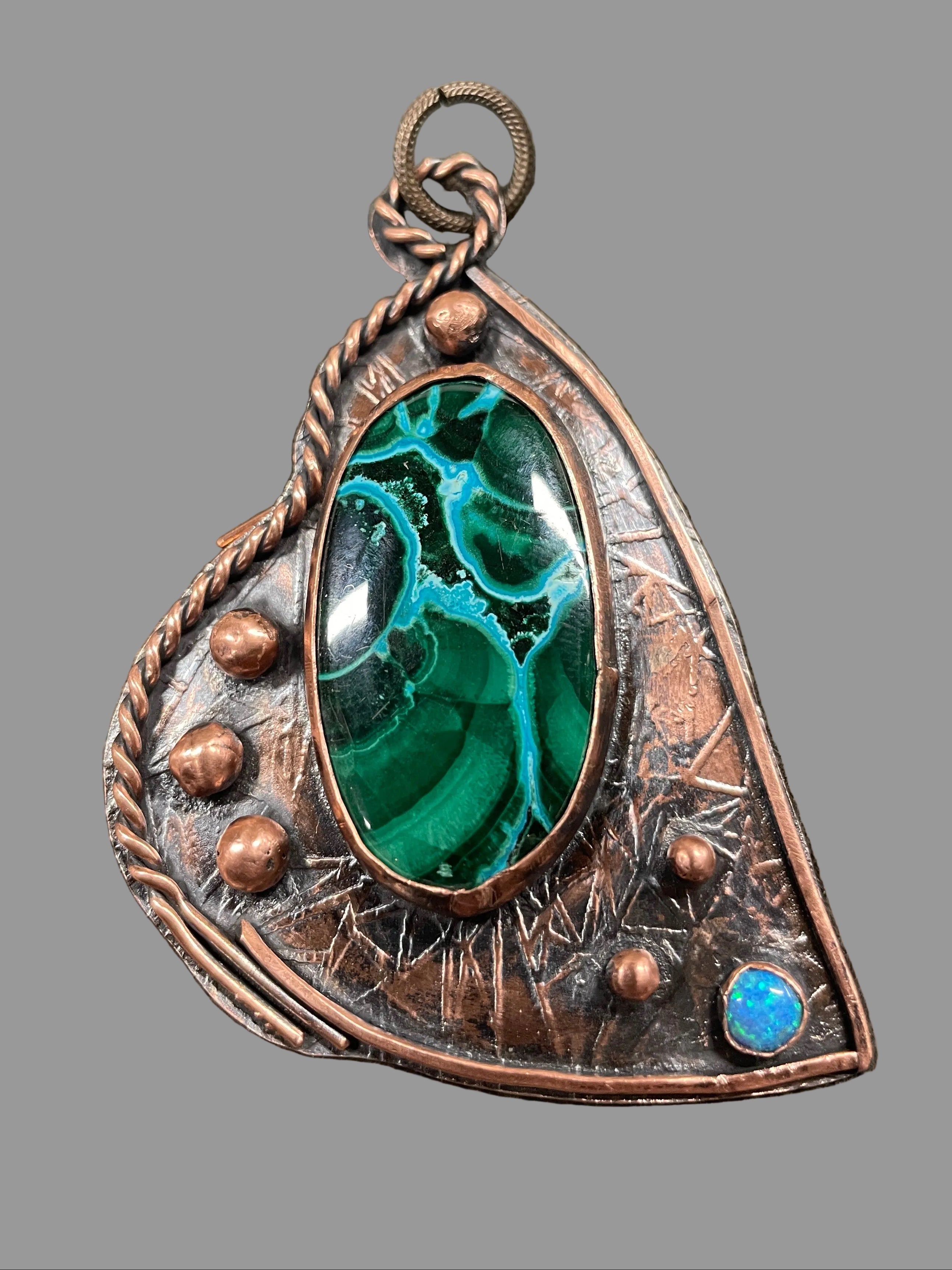 Stone on copper with small opal pendant