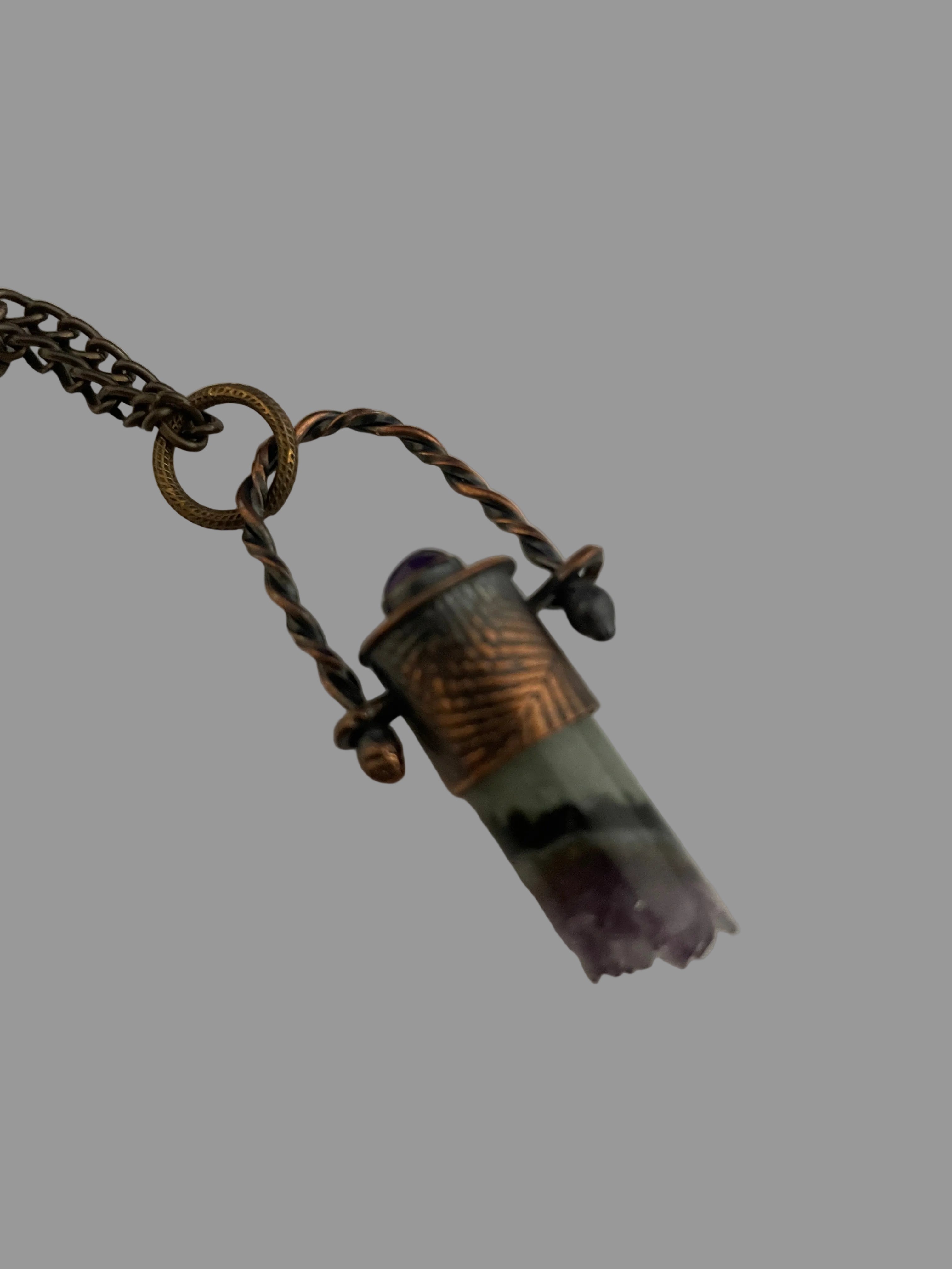 Stone pendant on twisted wire loop