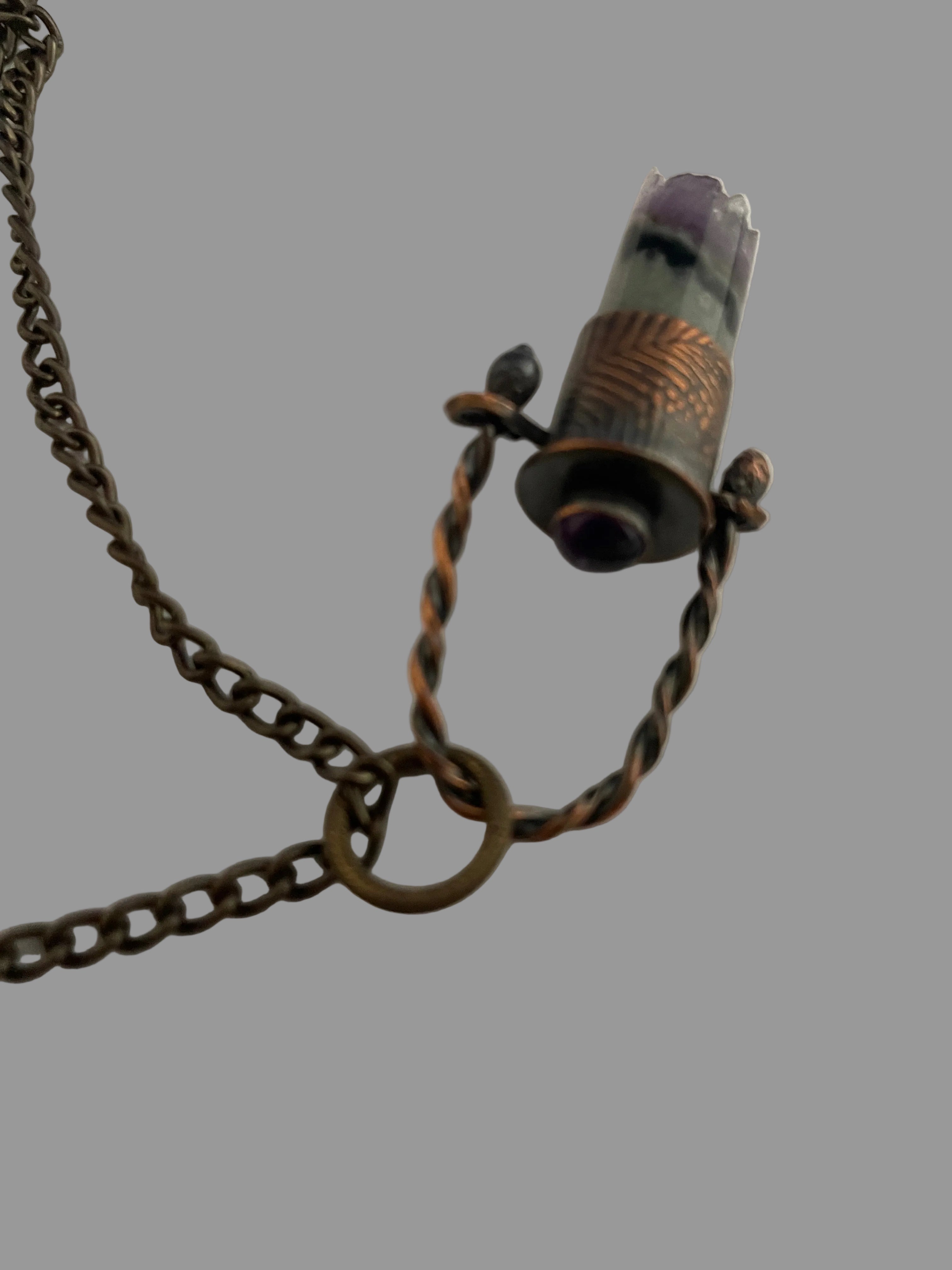 Stone pendant on twisted wire loop