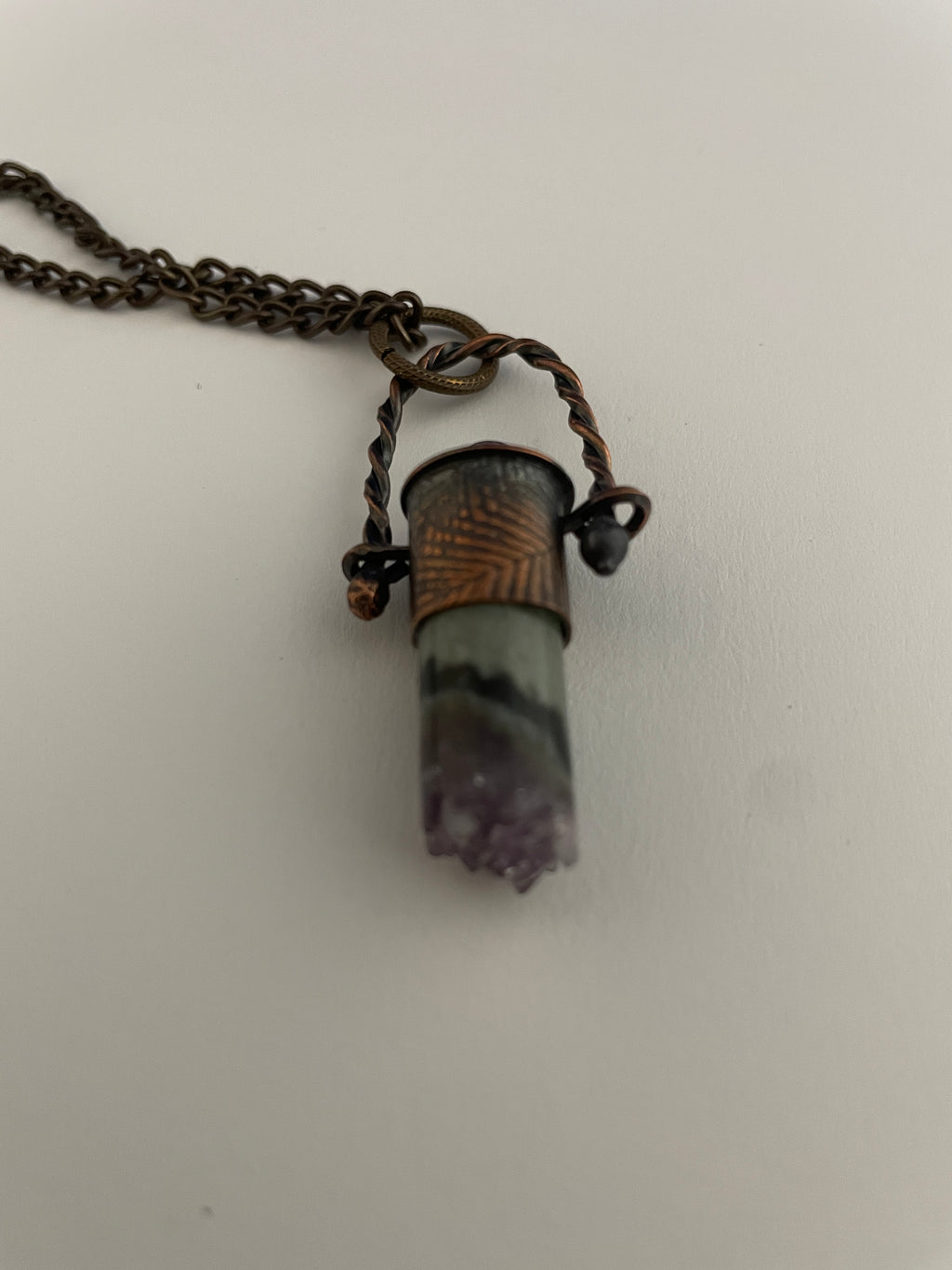 Stone pendant on twisted wire loop