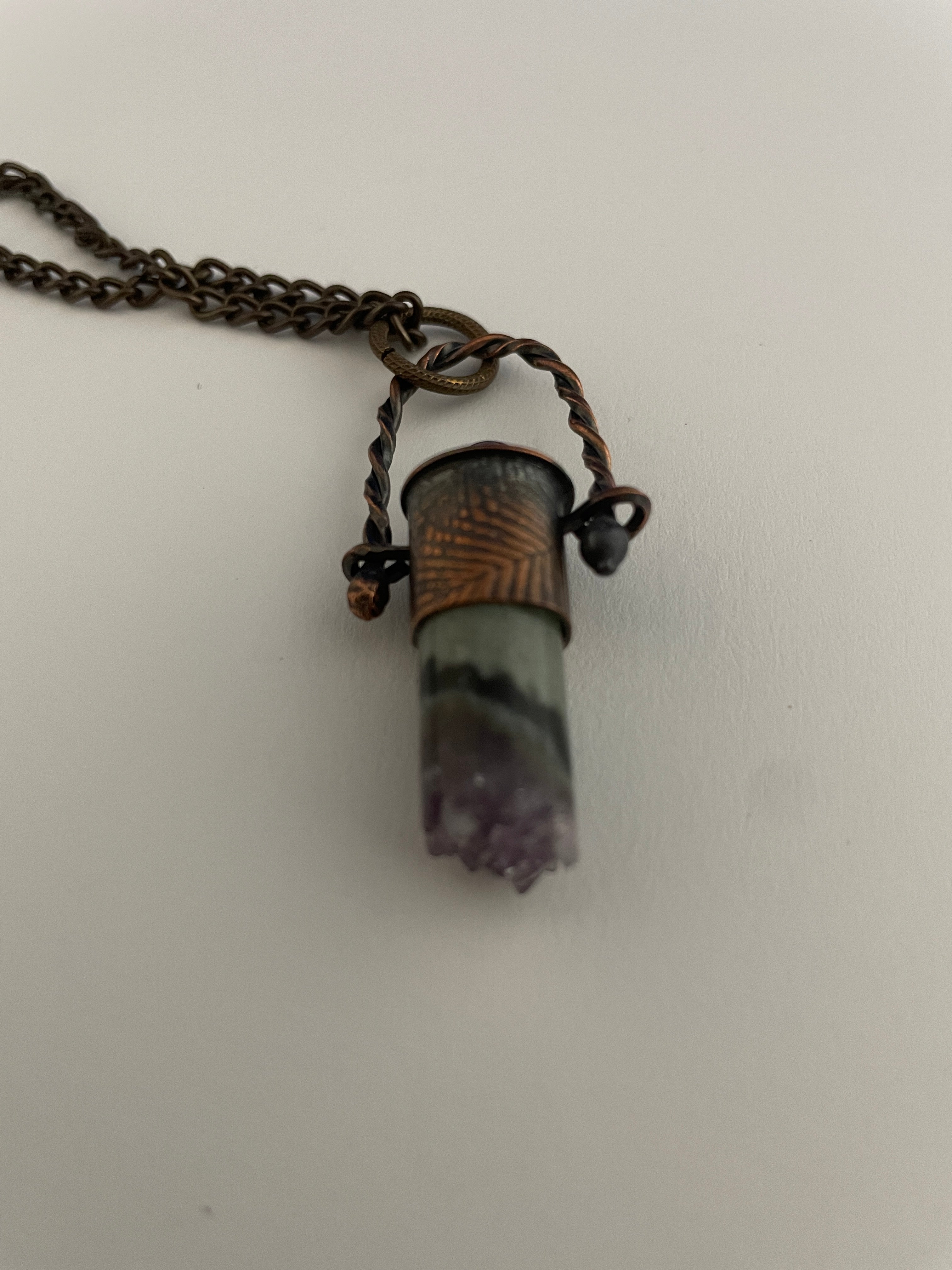 Stone pendant on twisted wire loop
