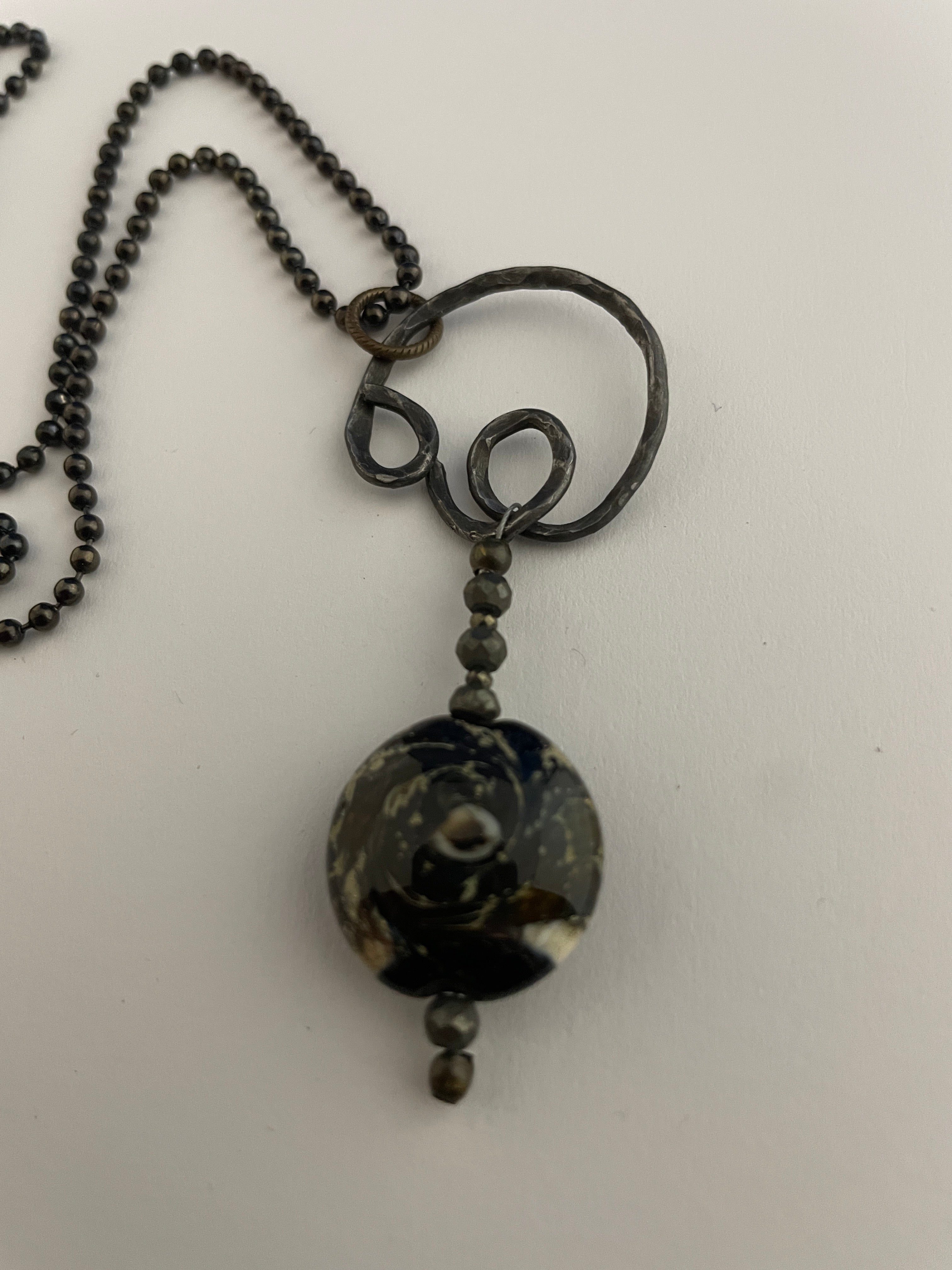 Steel and glass pendant