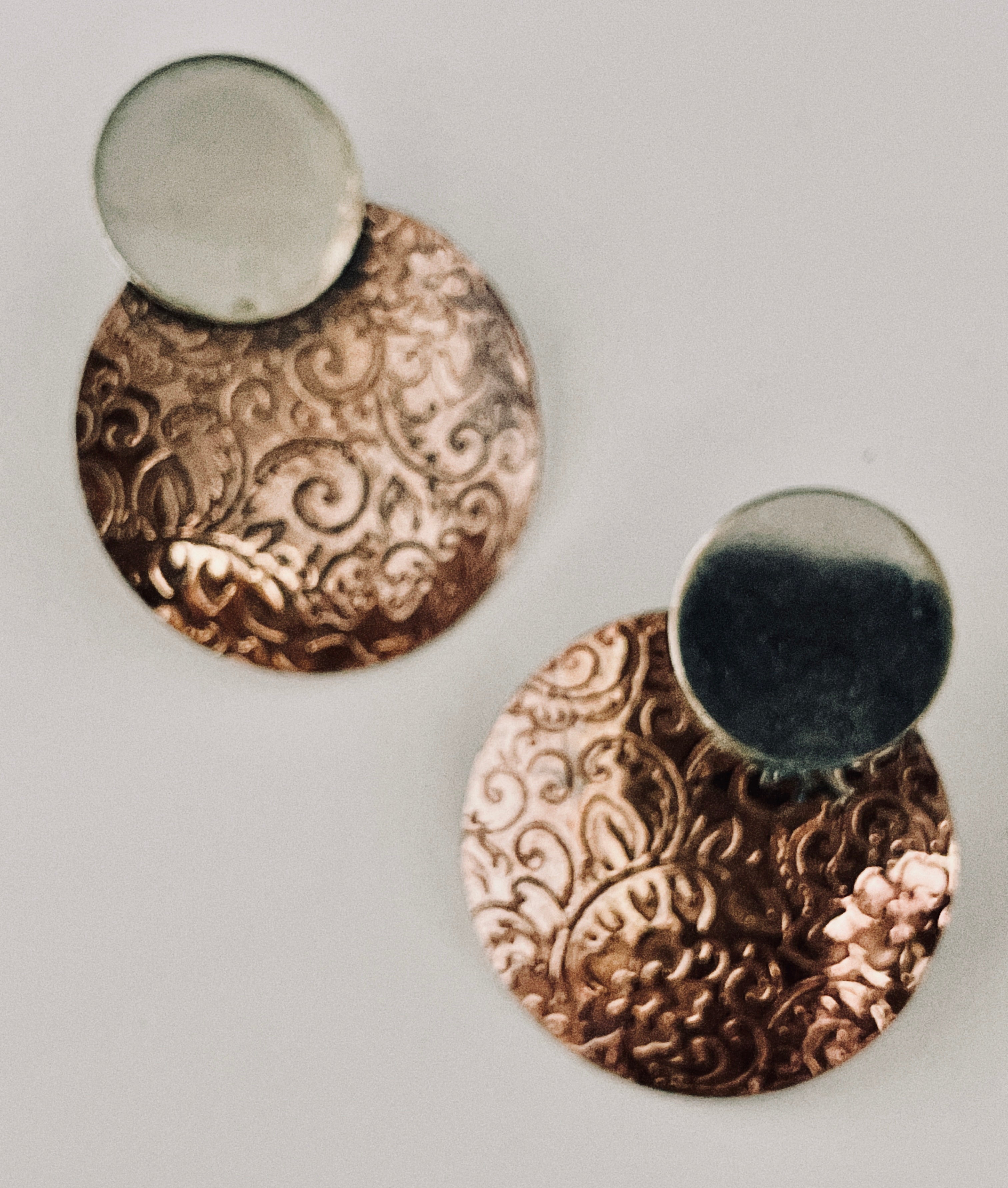 Copper earring with silver disk