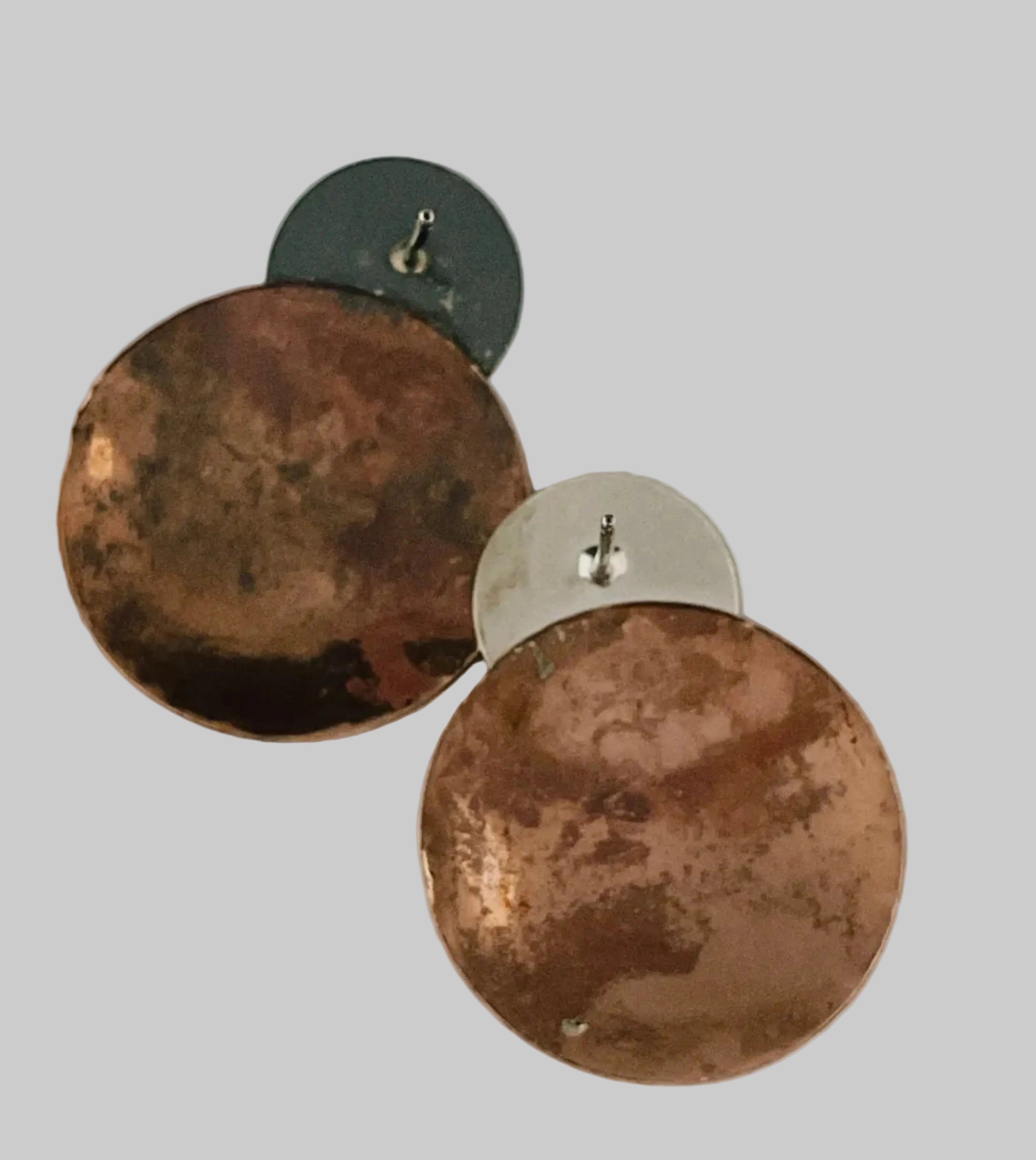 Copper earring with silver disk