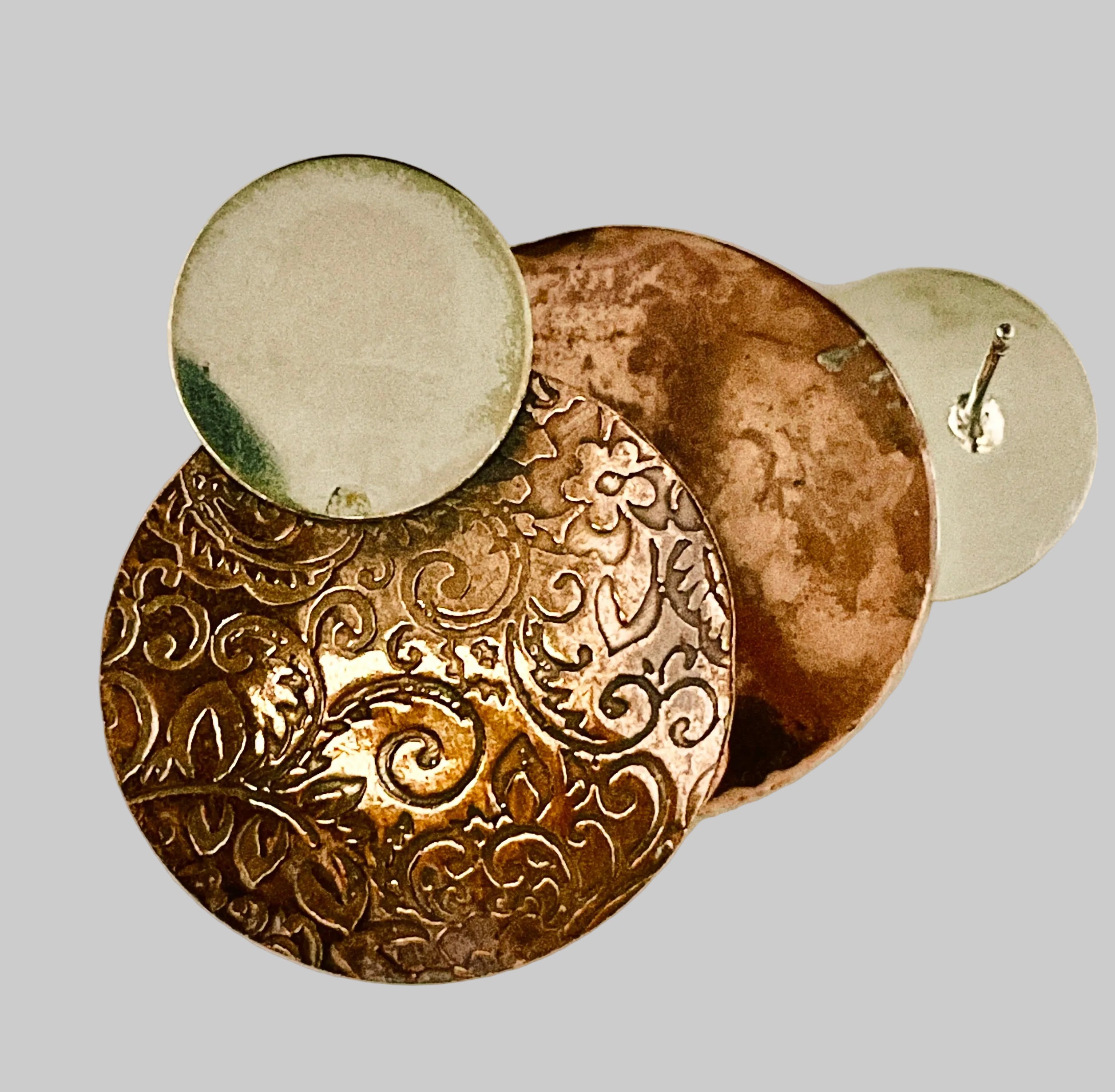 Copper earring with silver disk