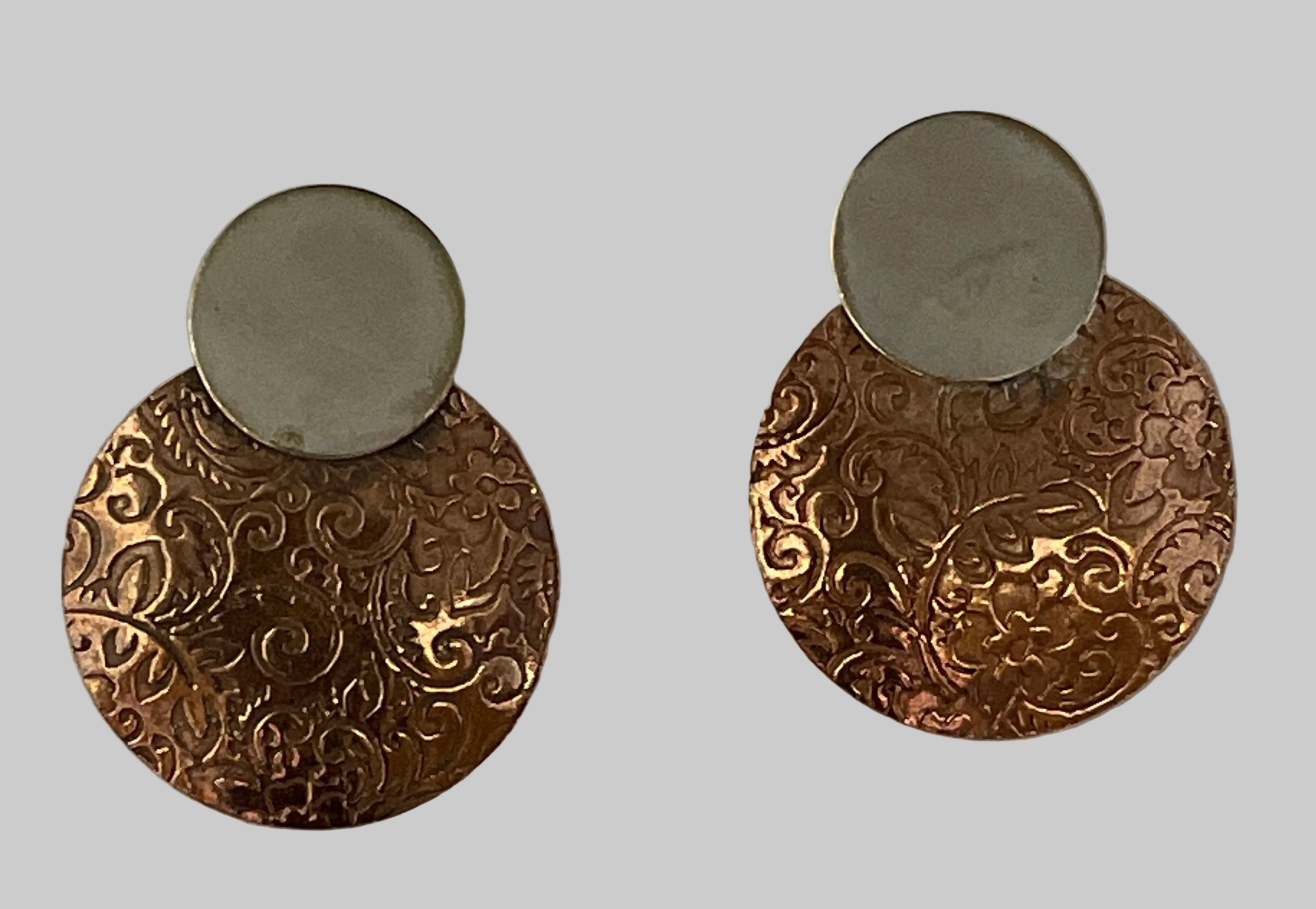 Copper earring with silver disk